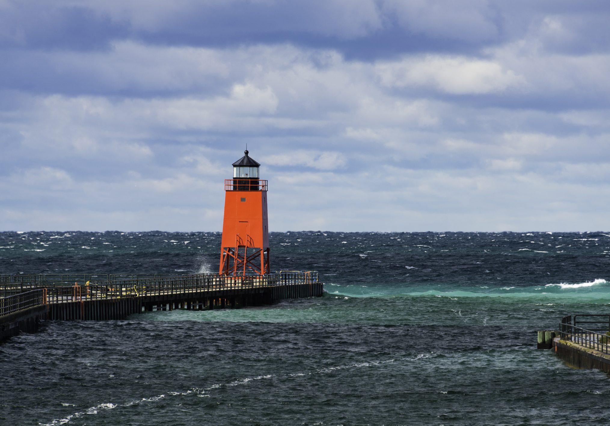 The Charlevoix South Pierhead Lighthouse against a dramatic sky.