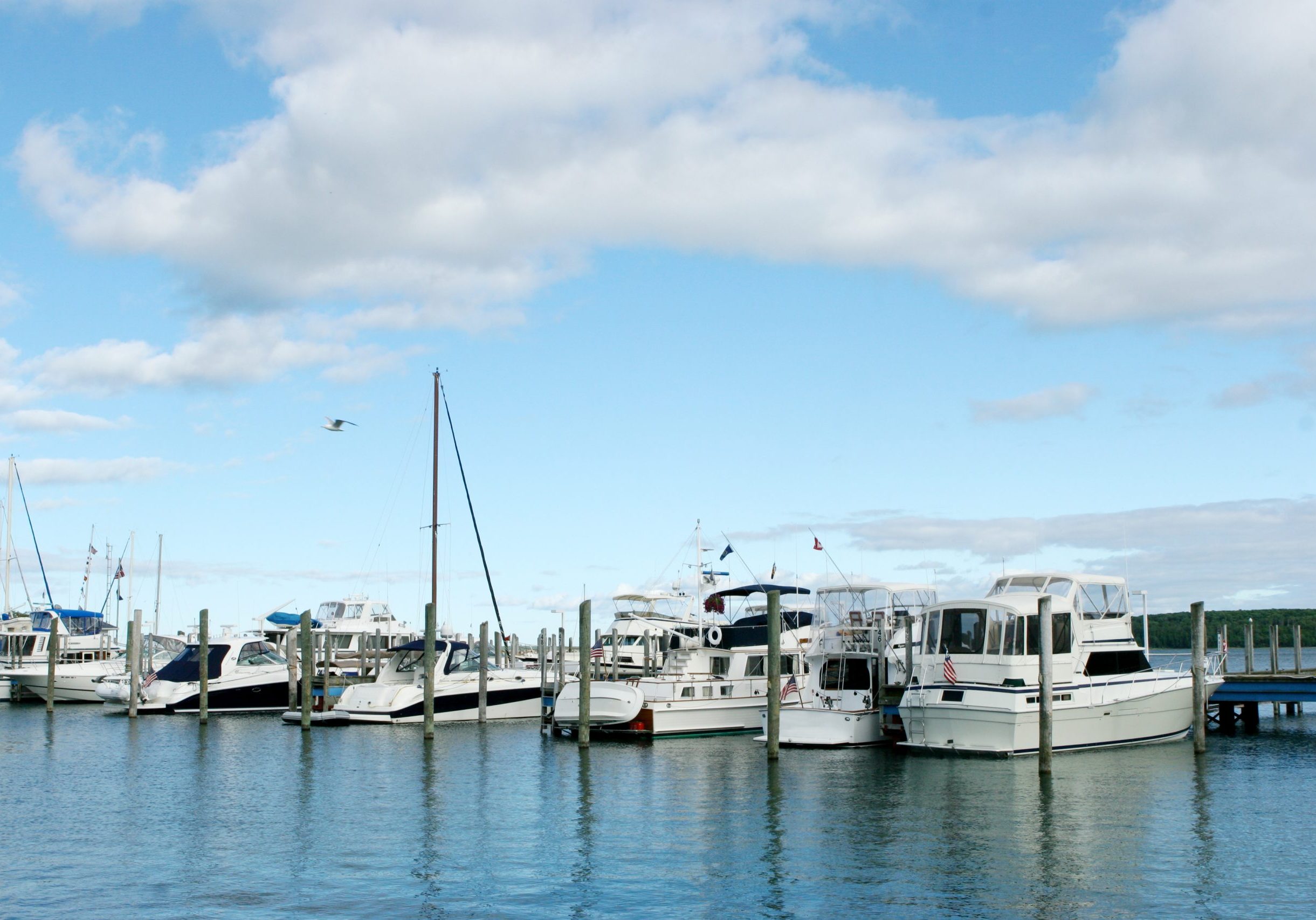 "A line of yachts and sailboats in the marina at Mackinac Island, Michigan."